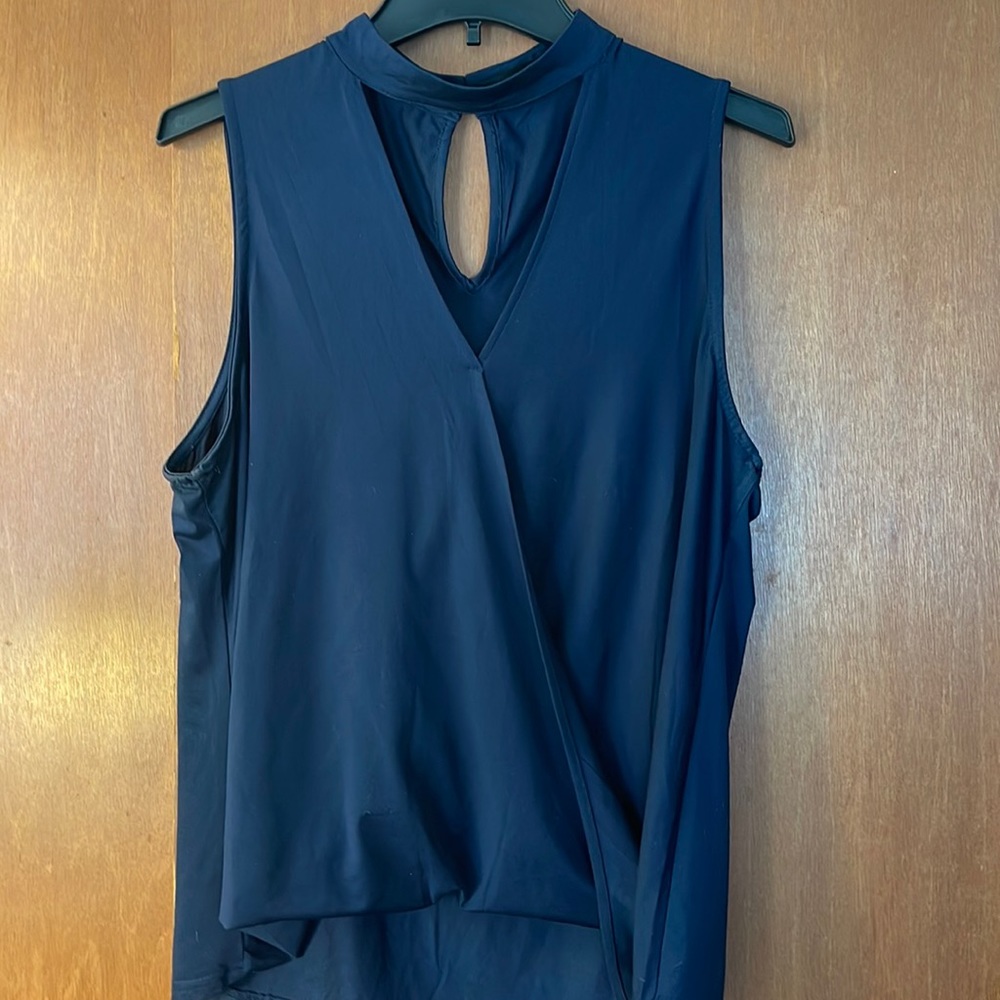 Navy sleeveless dress shirt with choker collar neckline